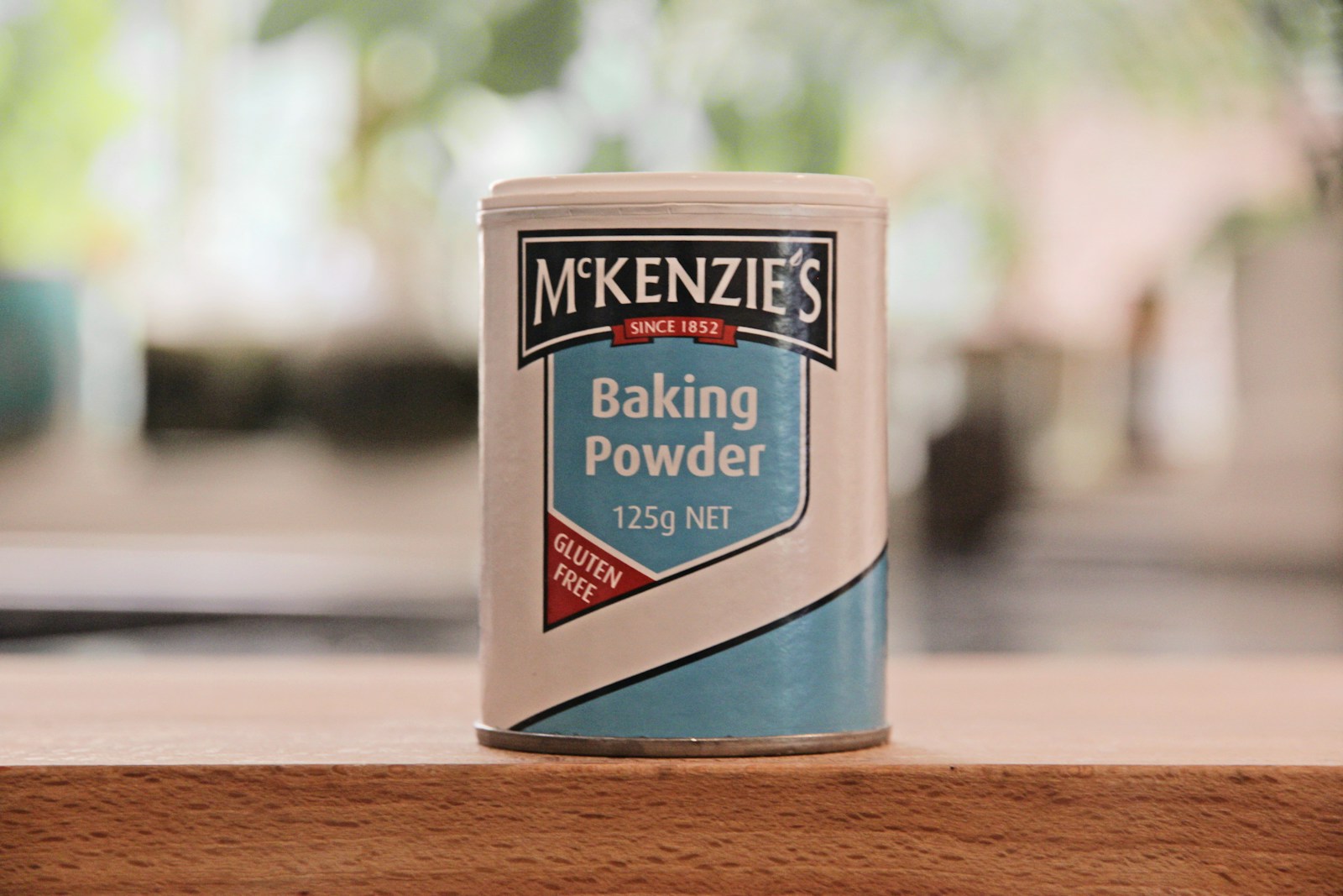 a can of baking powder sitting on a table